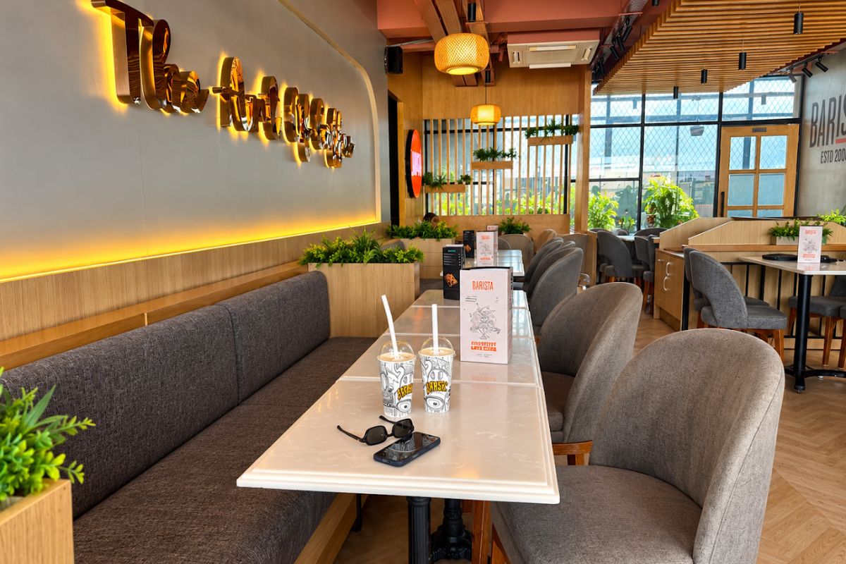 Calm polished seating area inside Barista at nauka vihaar, Gorakhpur